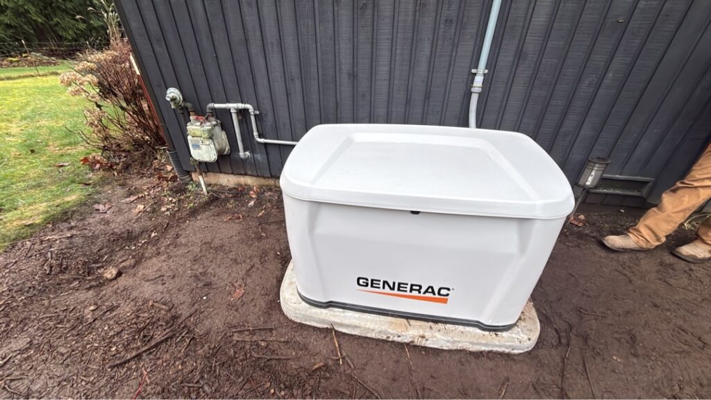 Newly installed Generac standby generator unit outside a home